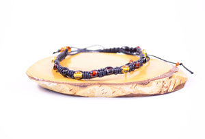 Baltic Amber Adjustable Braided Bracelet on wood